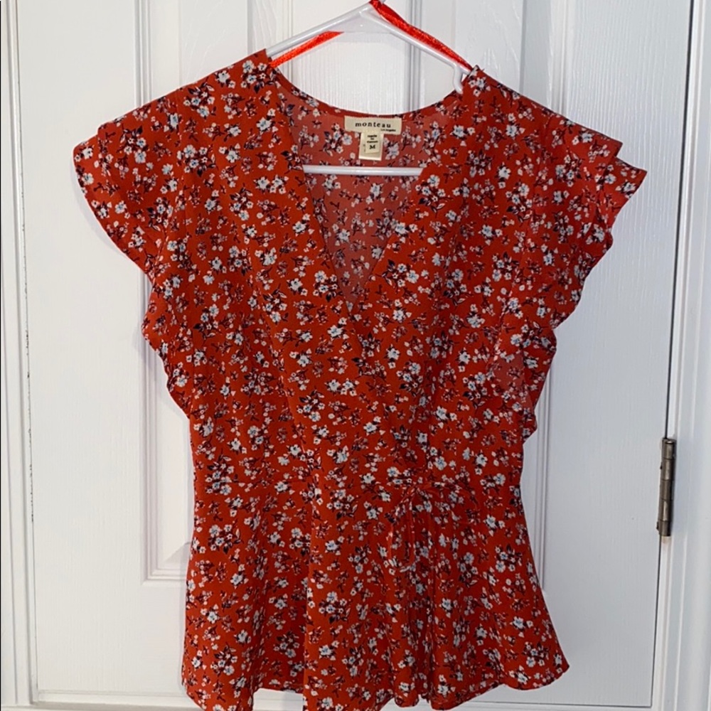 red, floral blouse